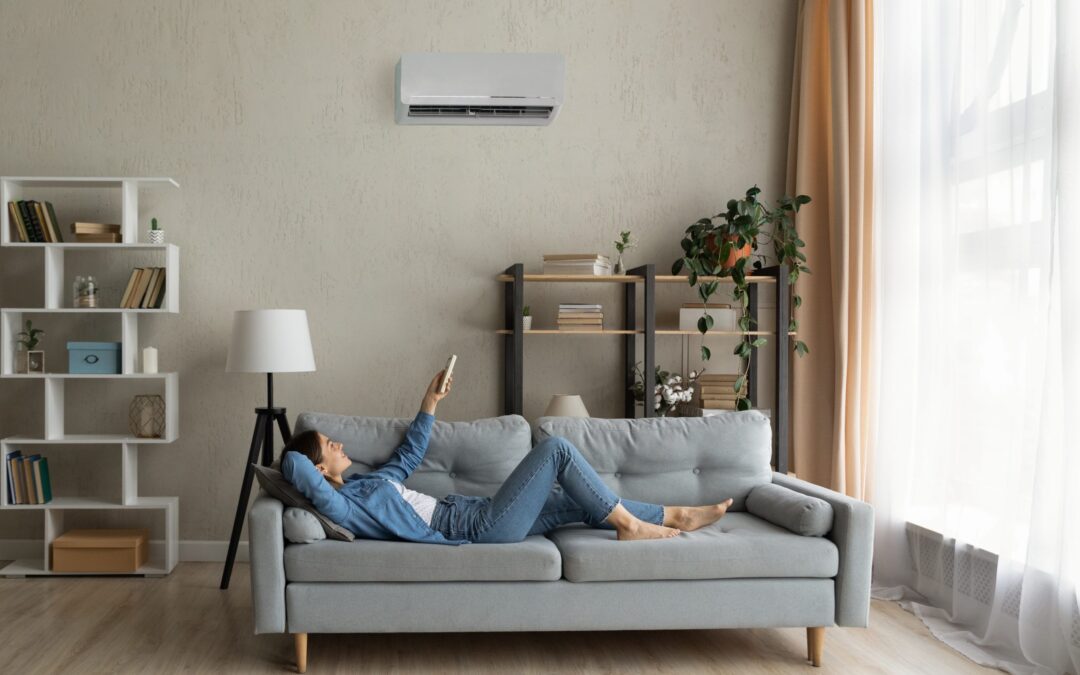 A woman using an air conditioner in Dallas